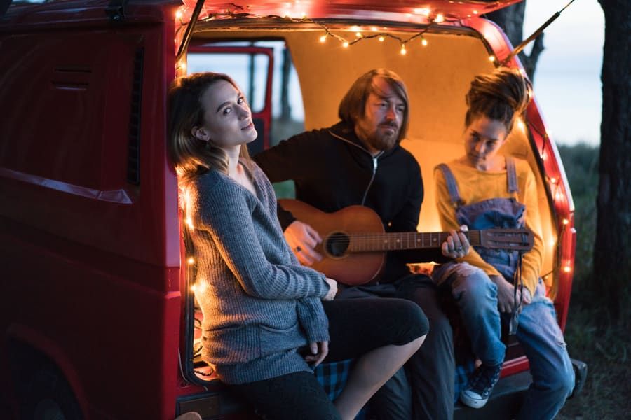 Friends singing in the back of a van