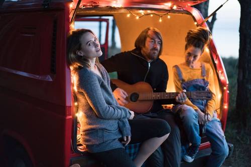 Friends singing in the back of a van